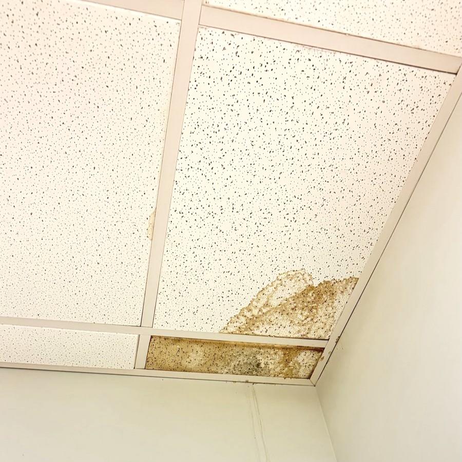 Water-damaged ceiling tiles ready for repair in NC