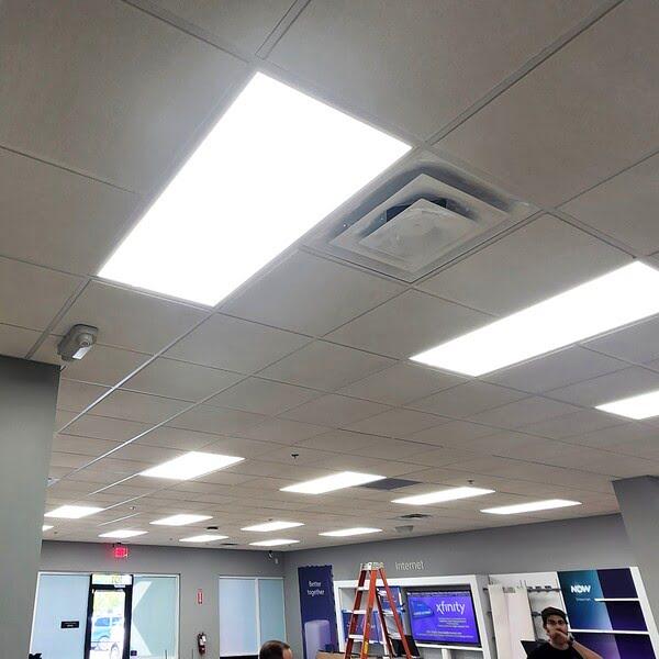 Acoustic ceiling tiles with lights in an Xfinity retail store